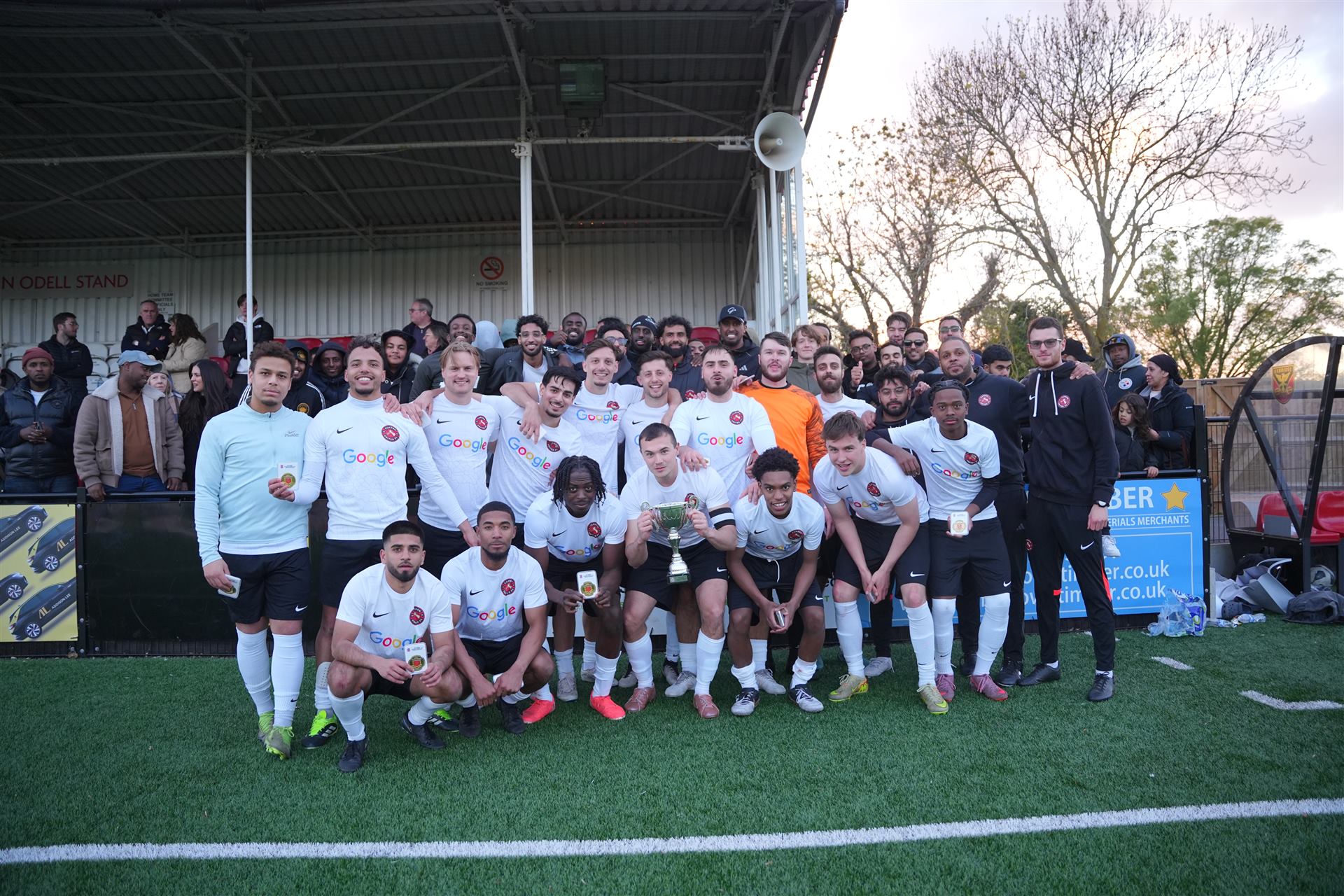 Camden United First Team celebrating with the trophy