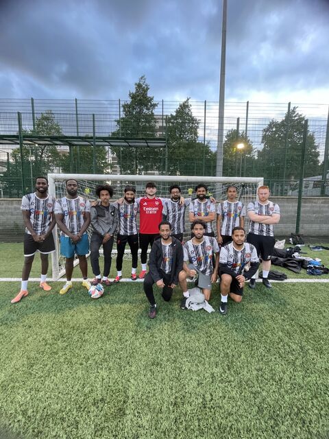 Camden United founding members team photo on the pitch
